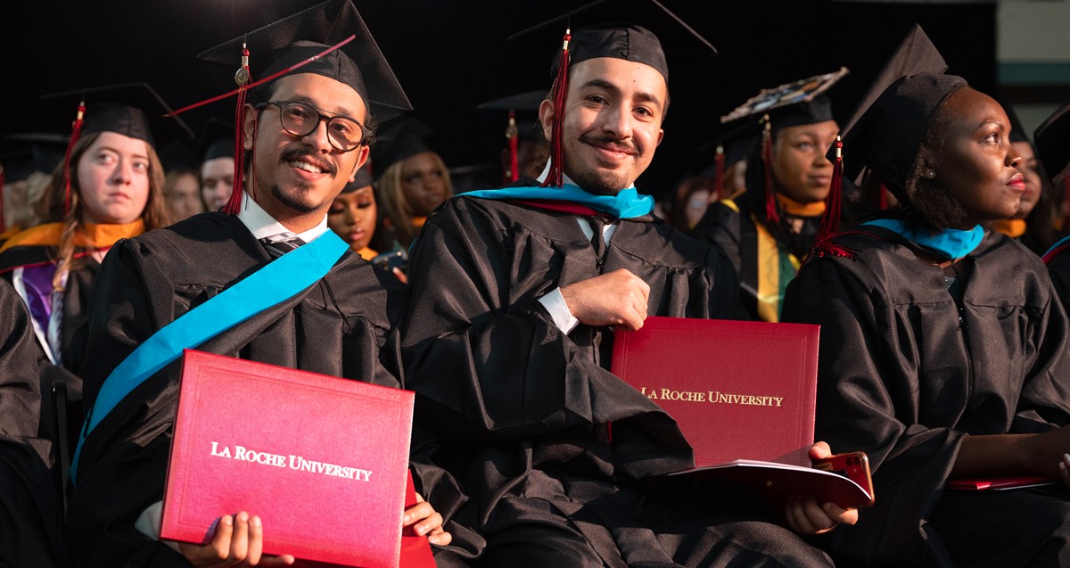 La Roche Graduates smiling at the camera at Commencement