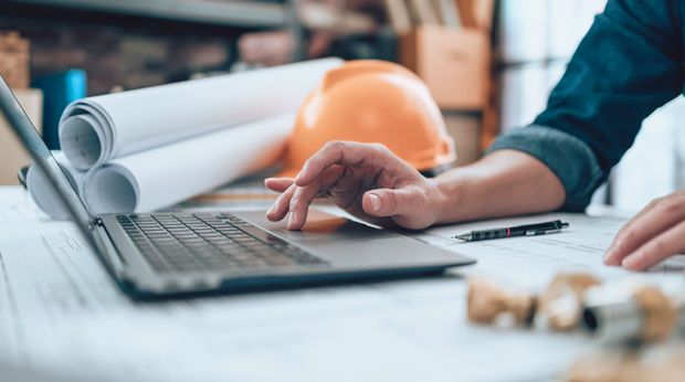 Engineer at desk on laptop