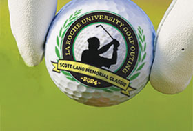 Golf ball with LRU logo on it