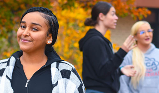 LRU stents standing outside of Wright Library