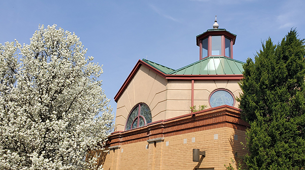 Chapel steeple with flowering trees