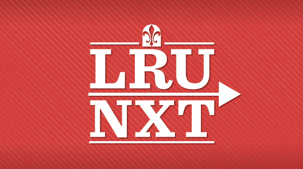 A white logo against a red background has the letters LRU NXT and La Roche University's fleur-de-lis mark. 