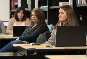 La Roche Interior Design students in classroom with laptops