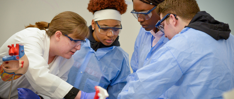 LRU students in medical lab with instructor for medical exercise