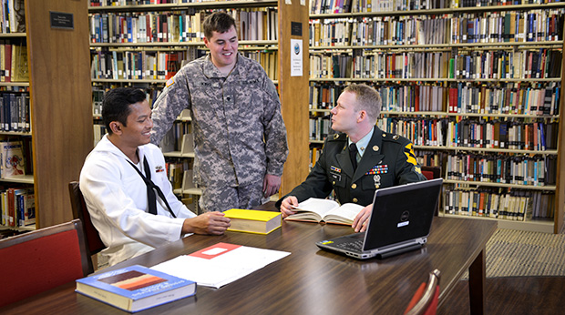 Military Students sitting at table in Library