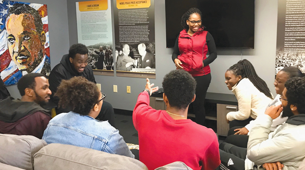 A group of La Roche University students have a discussion in the Martin Luther King lounge.