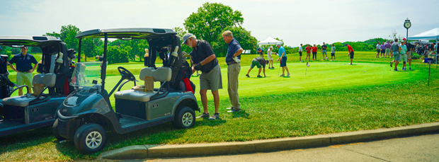 Participants at the Annual Golf Outing on the green