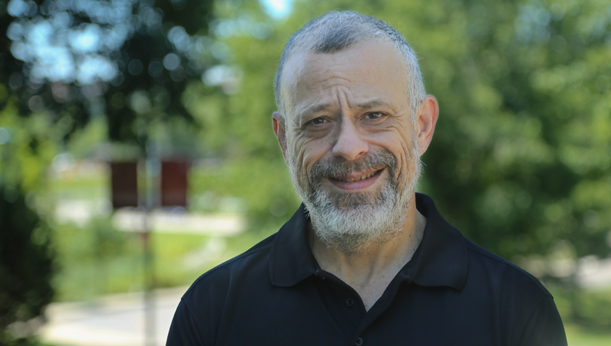 Student Anthony Colon stands outside on the La Roche University campus