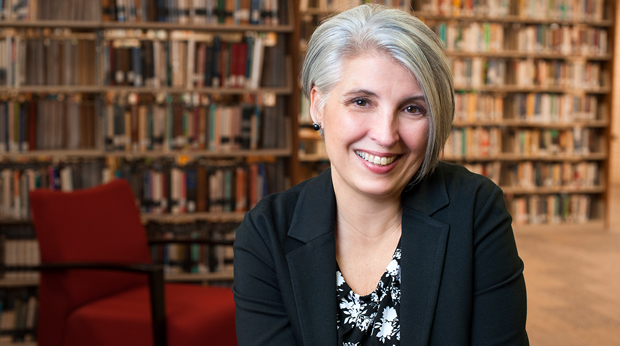 A graduate student sits in the Wright Library at La Roche University.