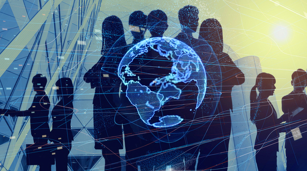 A shadow of a group of businesspeople in front of a glasswall. A fluorescent globe image is in the middle of the group's shadow.