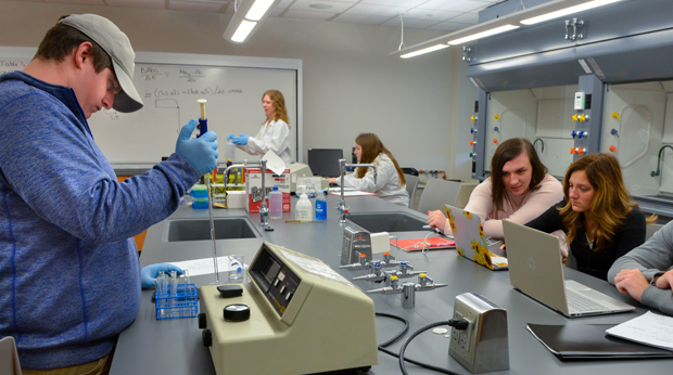 Several chemistry students at La Roche laboratory